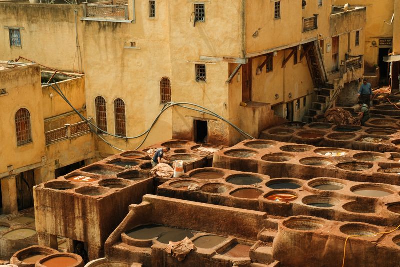 Colorful leather tanning vats seen from above in Fes