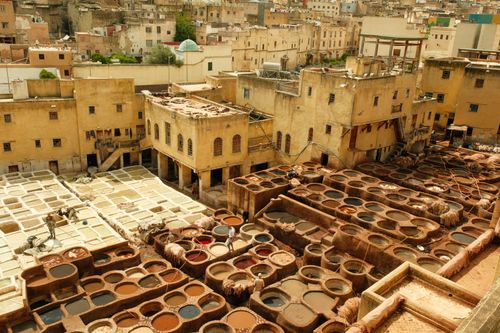 Free Aerial view of the historic leather tannery in Fez, Morocco, showcasing vibrant dye vats. Stock Photo