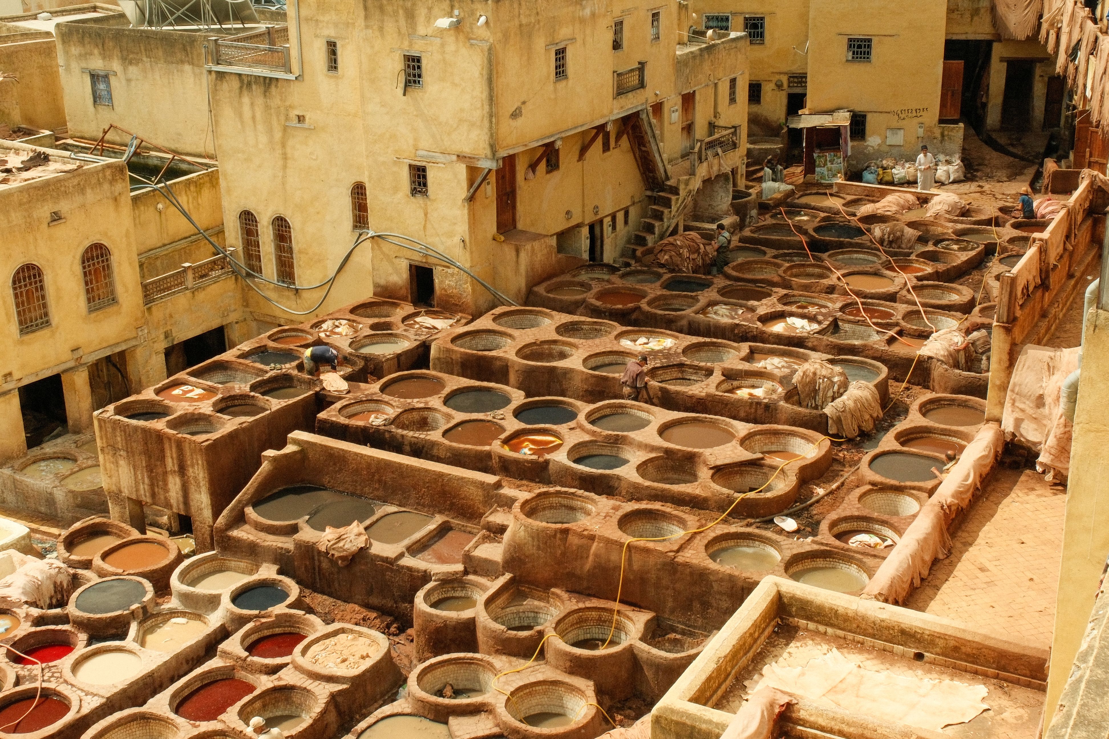 Aerial view of a traditional tannery in Fes, Morocco showcasing dyeing pits.