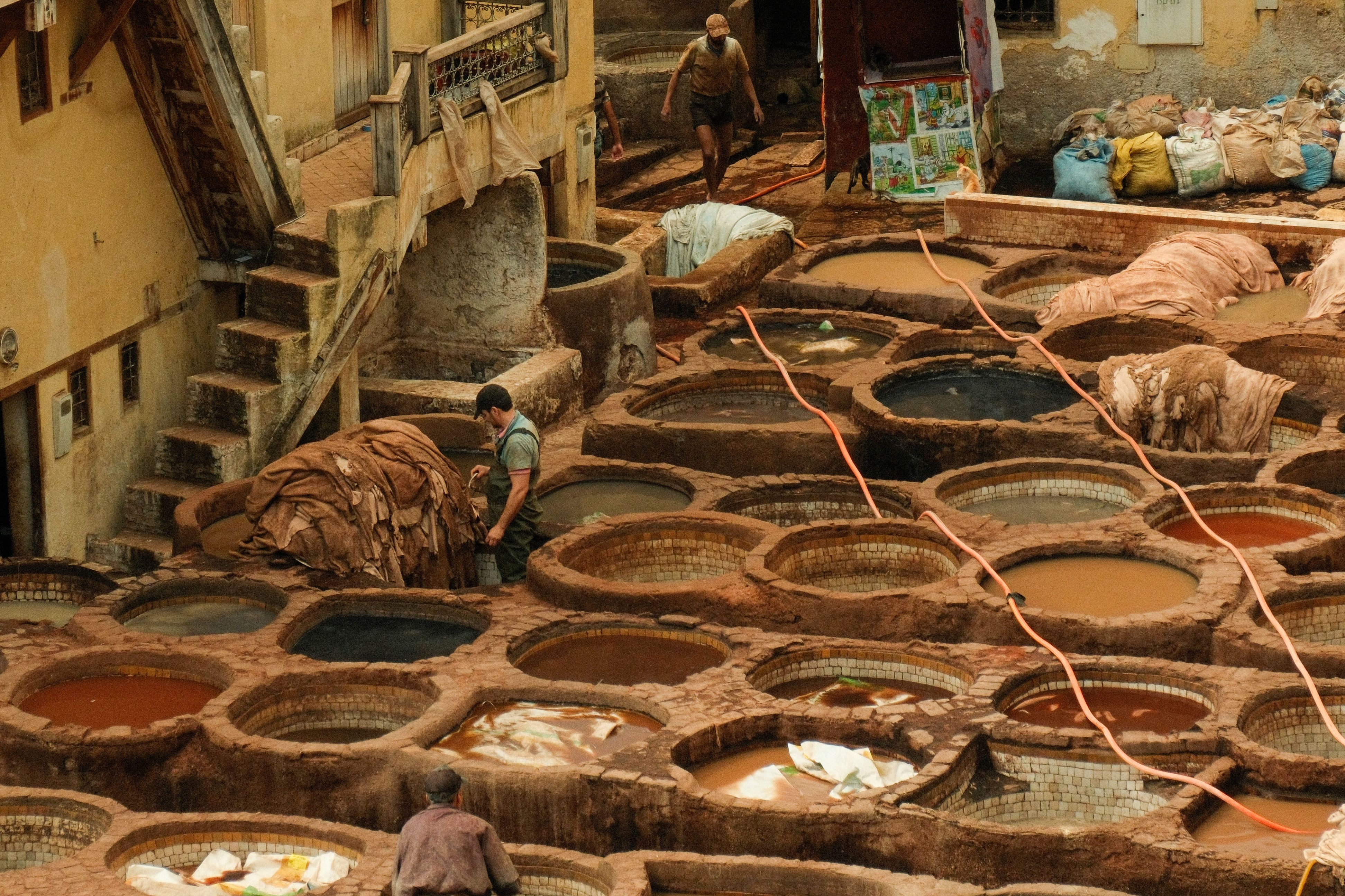 Photo by Ramon Karolan: Tannery workers in Fez Morocco processing leather