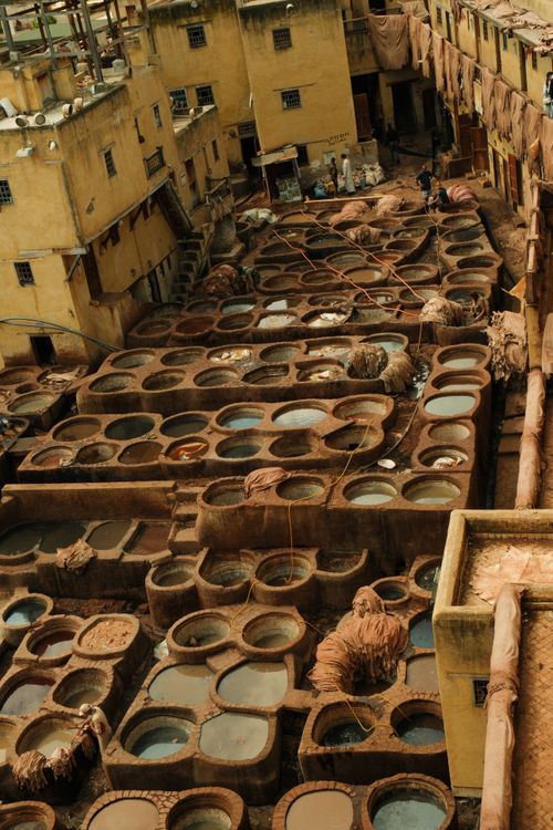 Free Aerial view of the historic leather tannery in Fes, showcasing traditional craftsmanship. Stock Photo