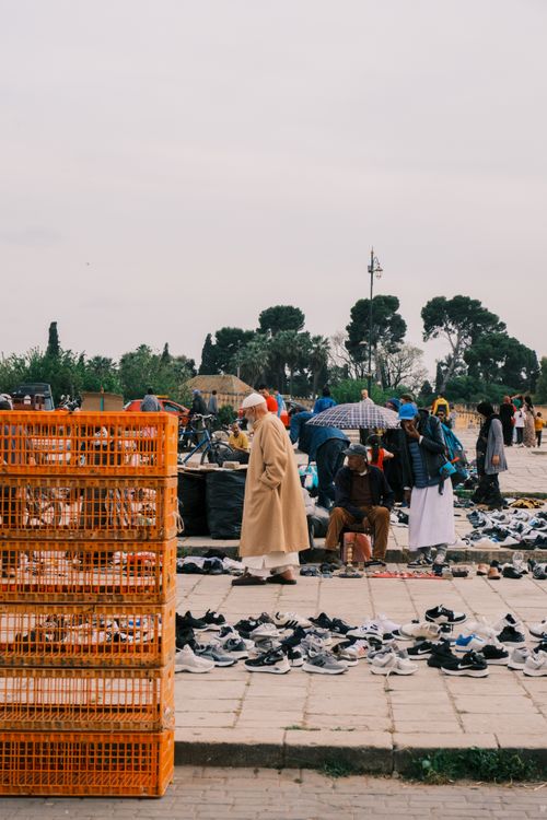 Free A bustling outdoor market scene in Fes, Morocco showcasing vendors and diverse products. Stock Photo