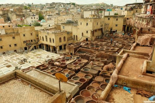 Free Overview of traditional leather tanneries in Fes, showcasing vibrant dye pits and historical architecture. Stock Photo
