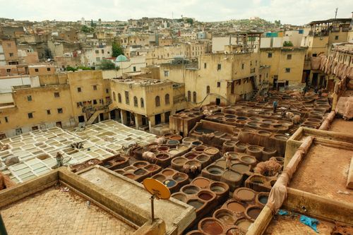 Free Traditional tannery in Fes, Morocco showcasing ancient leather dyeing processes. Stock Photo