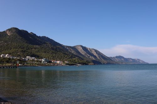 Free Idyllic coastal landscape of Mersin, Turkey, featuring serene blue water and lush mountains. Stock Photo