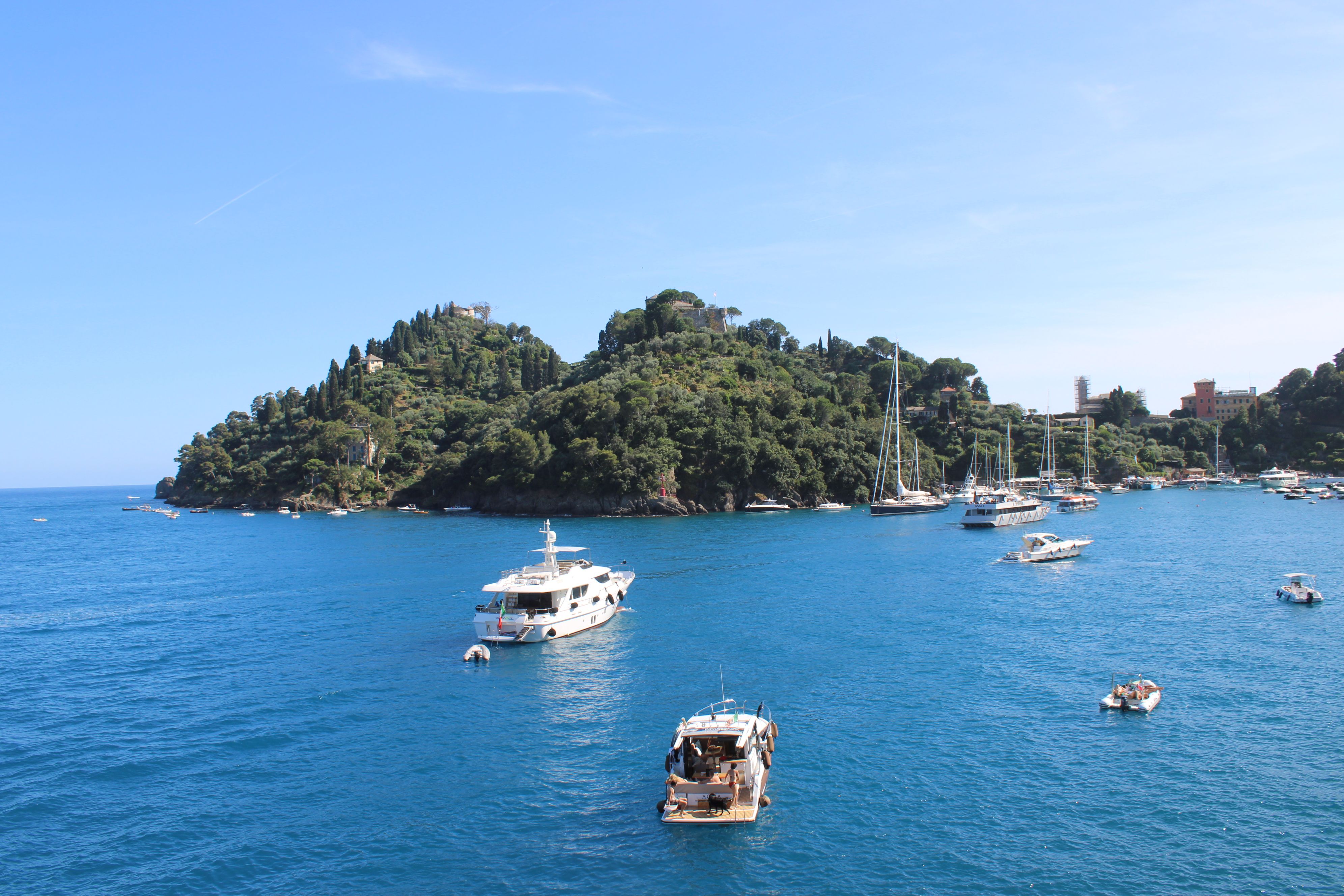 Unforgettable Alanya All Inclusive Yacht Tour With Hotel Transfer Review 2026 - Tranquil scene of yachts and boats in Portofino, Italy, under a clear summer sky.
