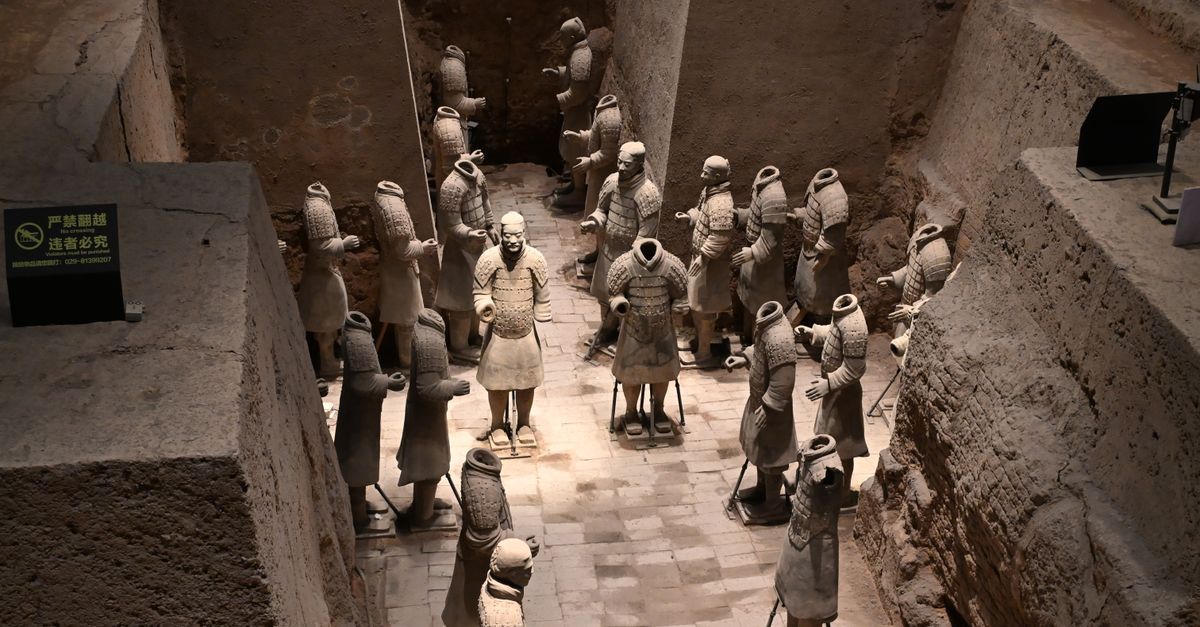 Close-up view of the famous Terracotta Army statues unearthed in a pit, showcasing ancient Chinese history.