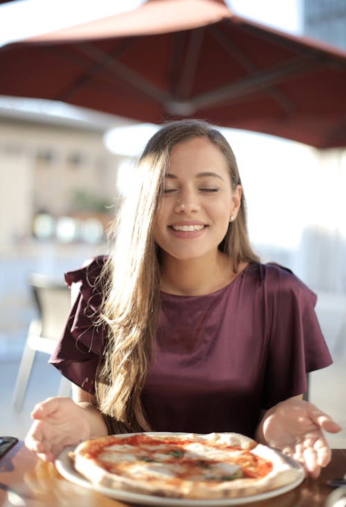 Woman in Purple Top Smiling