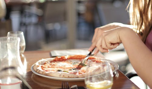 Free Person Slicing Pizza Stock Photo