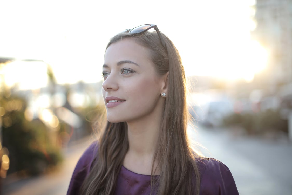 Shallow Focus Photo of Woman Wearing Purple Top