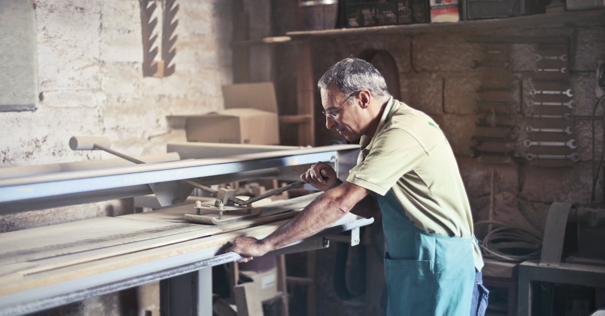 Photo of Man Using Gray Metal Tool · Free Stock Photo