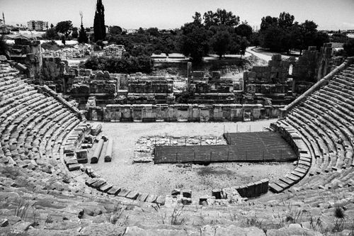 Free Black and white photo of an ancient Greek amphitheater ruins, showcasing impressive architecture. Stock Photo
