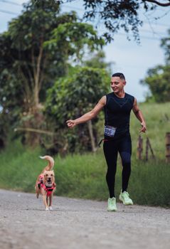 A man runs with his dog outdoors, enjoying a healthy lifestyle in rural Colombia.