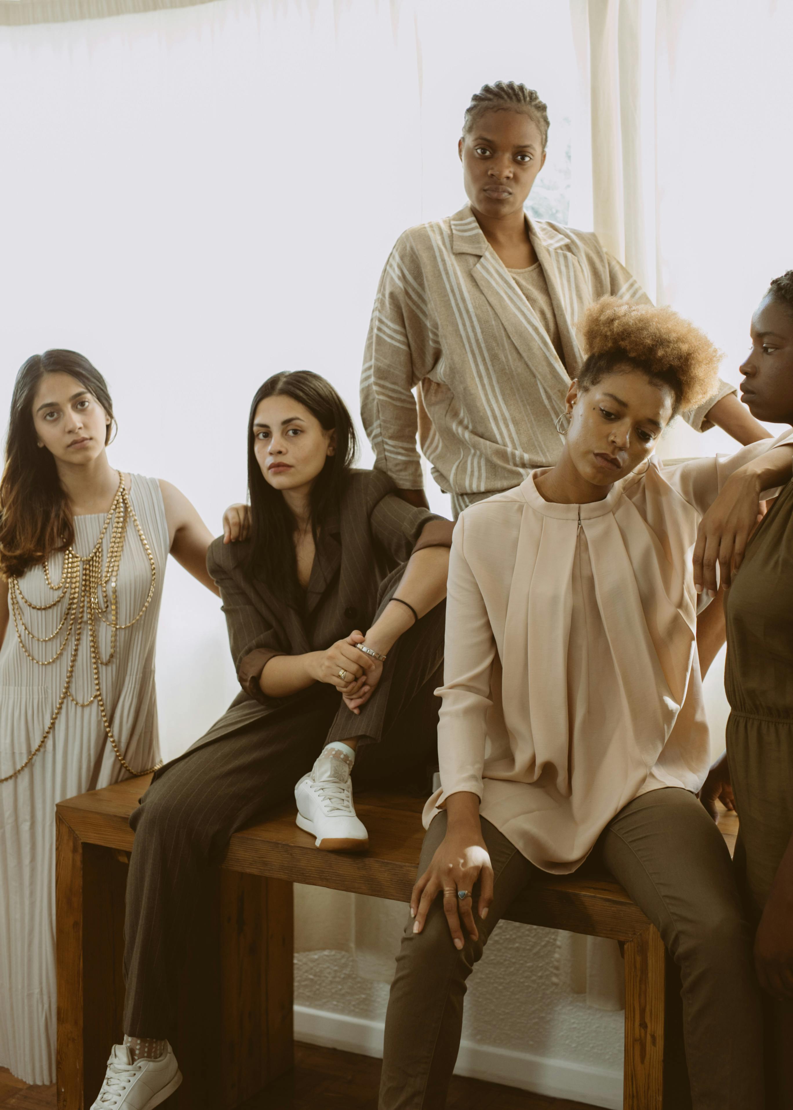 photo of women posing while looking serious