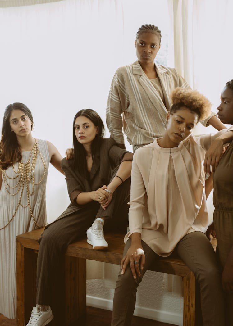 Photo Of Women Posing While Looking Serious