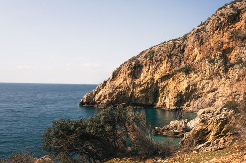 Free Breathtaking view of rugged coastal cliffs and the Mediterranean Sea in Hatay, Türkiye. Stock Photo