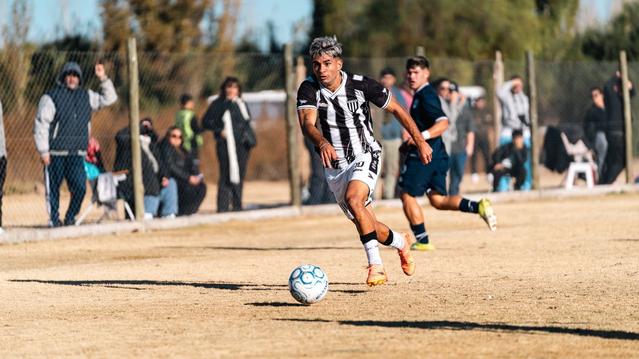 soccer player in action during a match on a sunny day showcasing teamw