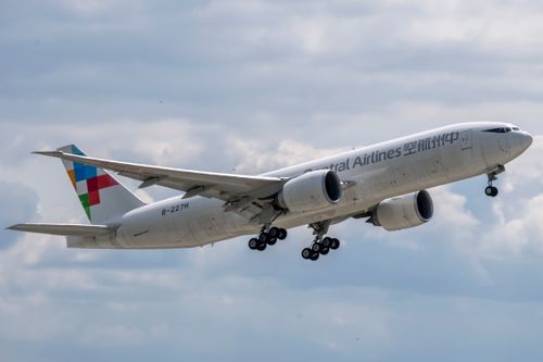 Free A commercial aircraft from Central Airlines captured in mid-flight against a cloudy sky backdrop. Stock Photo