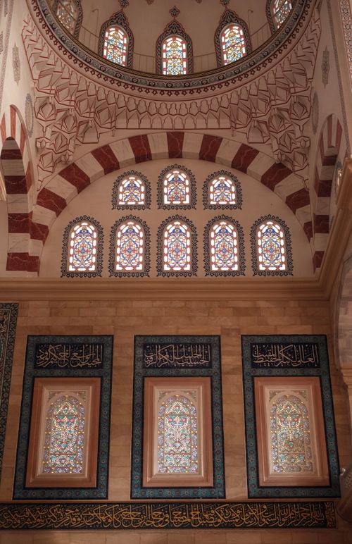 Free Interior view of a mosque with beautiful stained glass and intricate dome design. Stock Photo
