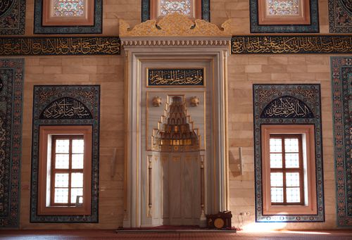 Free Beautiful mosque interior showcasing Islamic architecture and Arabic calligraphy. Stock Photo