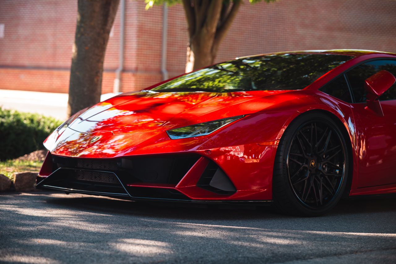 vibrant red sports car parked outdoors showcasing sleek design and mod