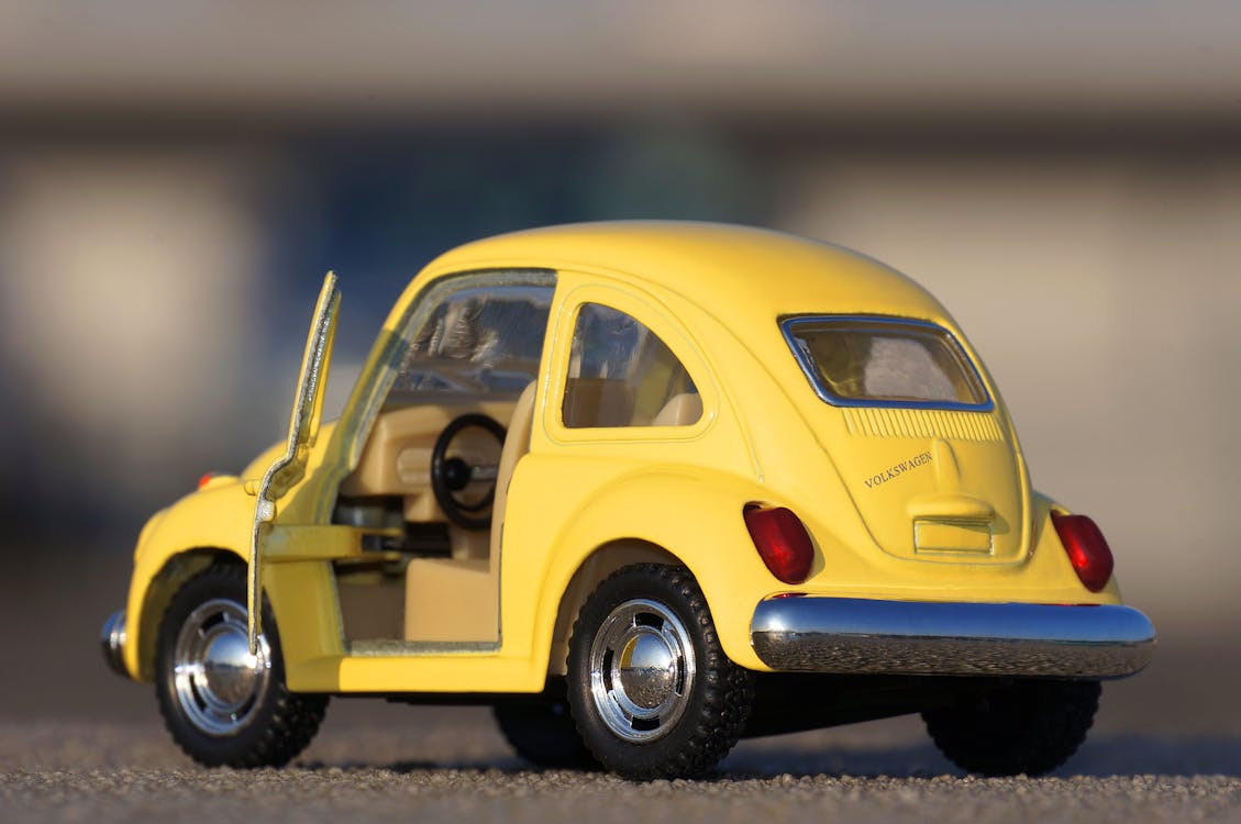 Yellow Volkswagen Beetle Die-cast on Floor