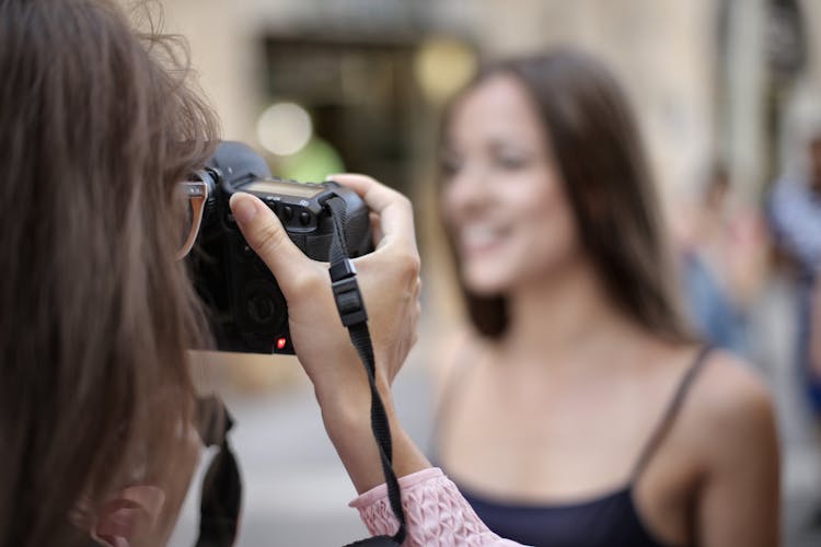 Photo Of Person Taking Photo Using Black Camera