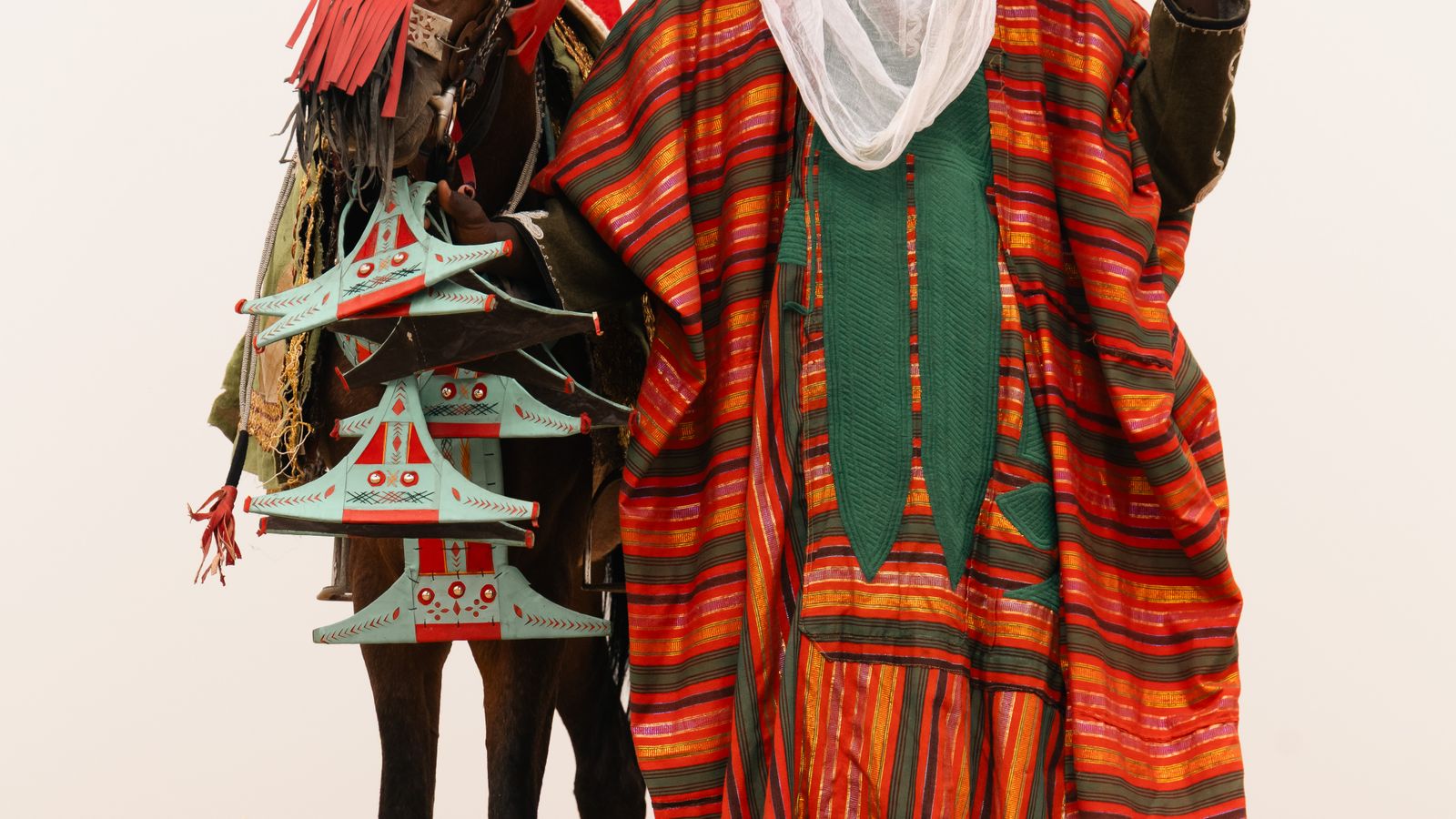 Traditional african horseman in vibrant attire, Mali