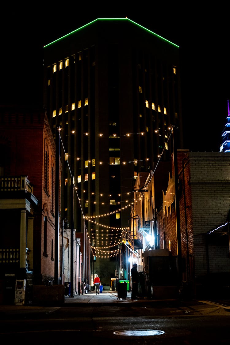 Photo Of Person Walking In Alley