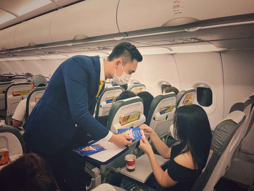 Airline staff assisting passengers at a Chinese airport