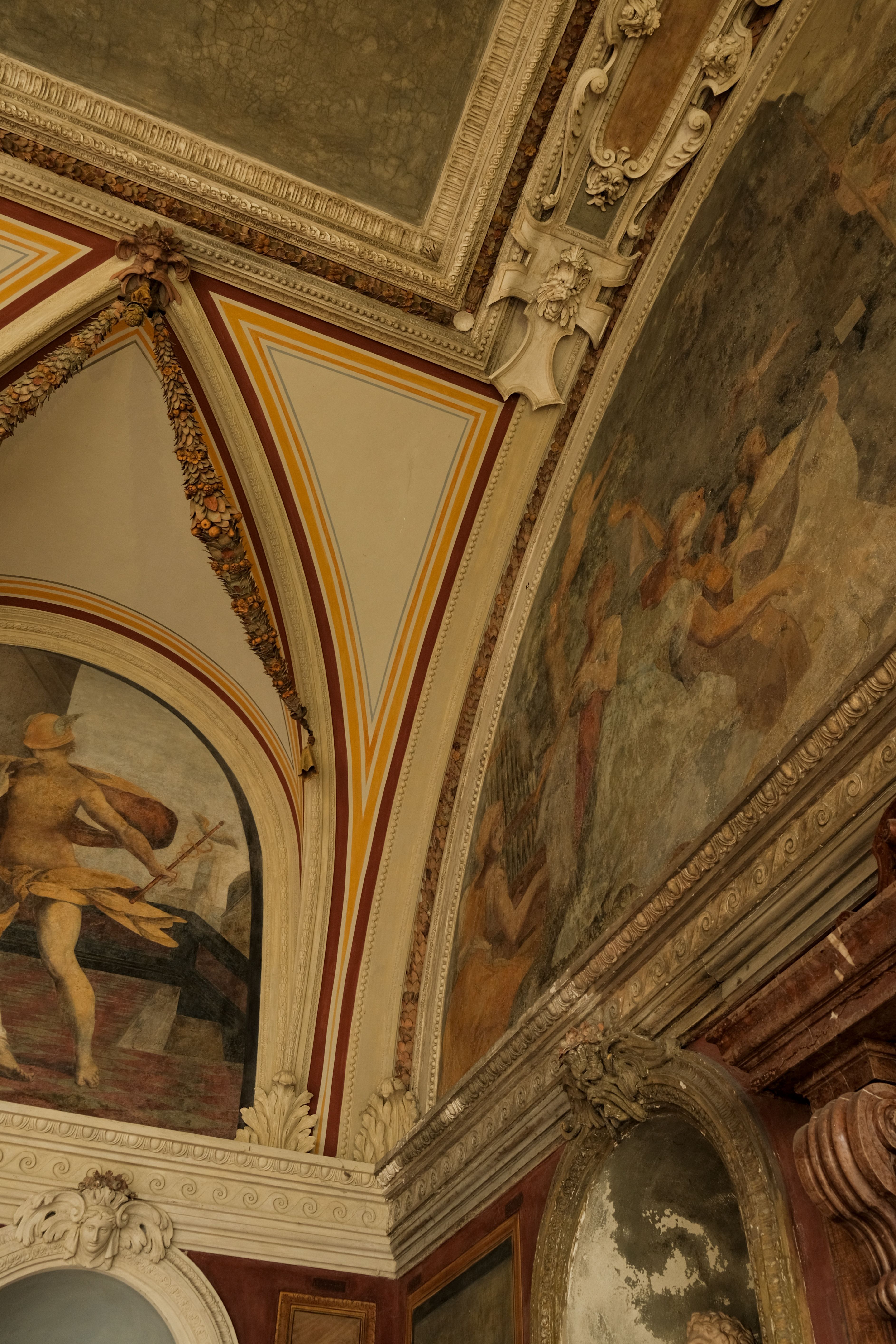Detailed view of a decorative fresco on a historical ceiling with classic architecture.