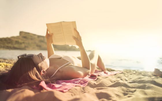 Woman in swimsuit reading a book on a sunny beach, perfect relaxation moment.