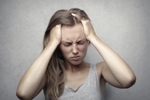 Free Woman in Gray Tank Top Showing Distress Stock Photo