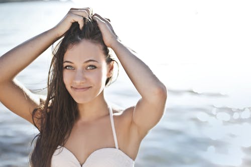 Woman in White Bikini Top Smiling