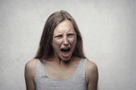 Woman in Gray Tank Top Shouting