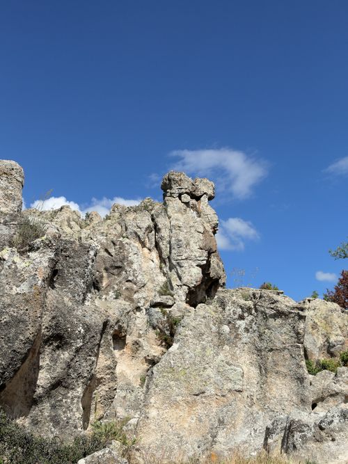 Free Stunning rock formations bask under a clear blue sky, showcasing nature's artistry. Stock Photo