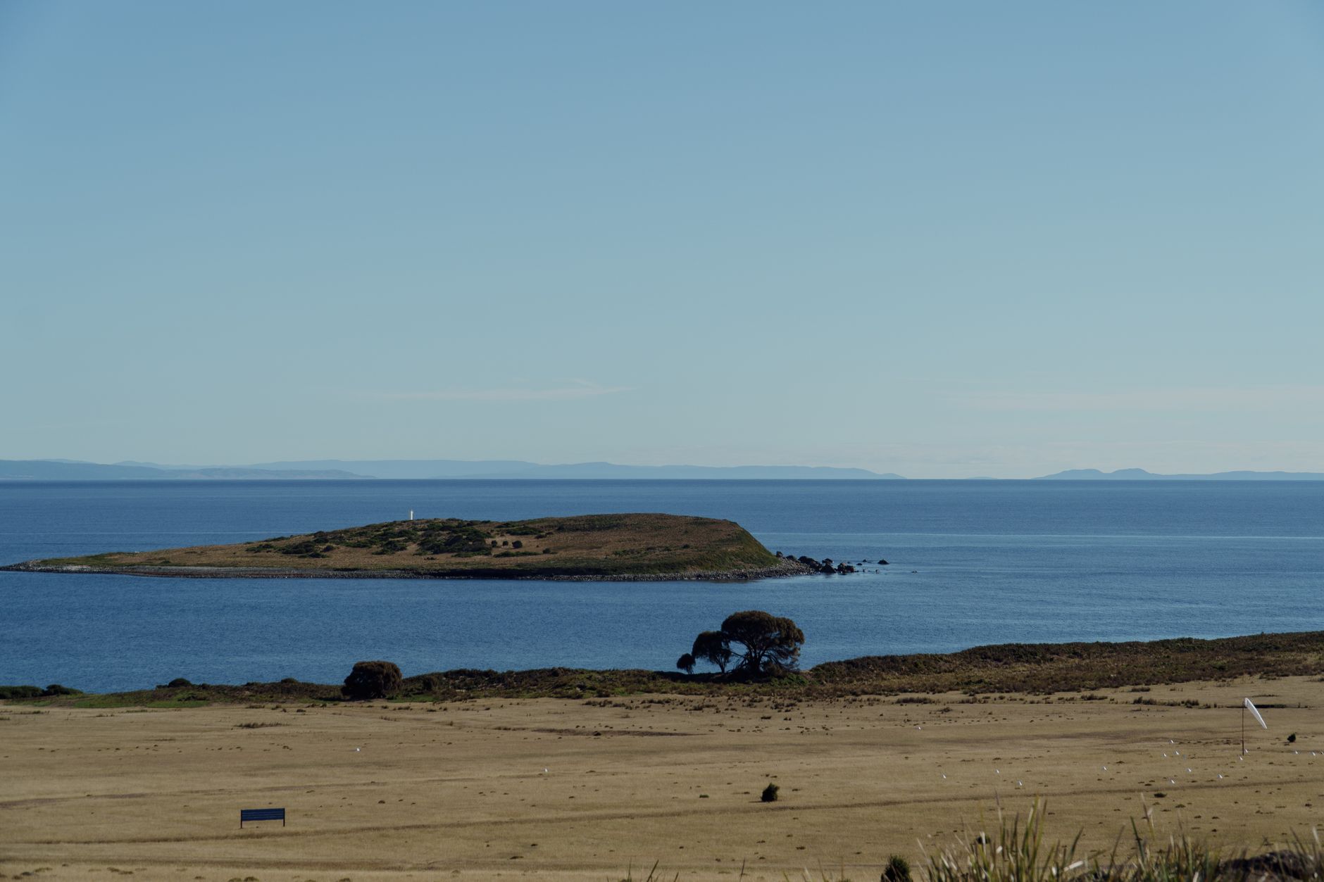 Explore the serene coastline of Maria Island, Tasmania, with its vast blue waters and unique landscapes.