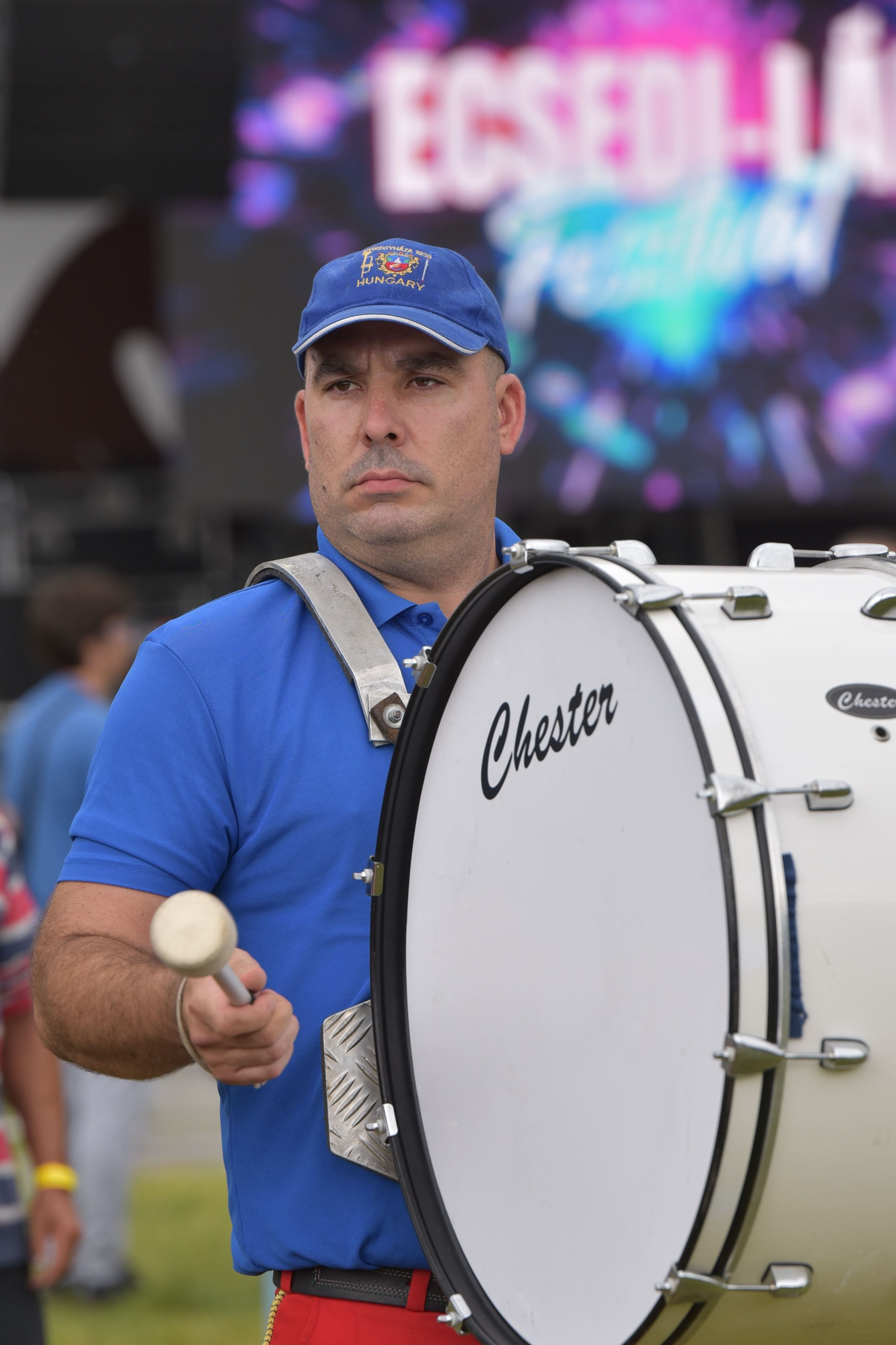 Man playing bass drum at Ecsed-Lak Festival in Nagyecsed, Hungary. Vivid and lively scene.