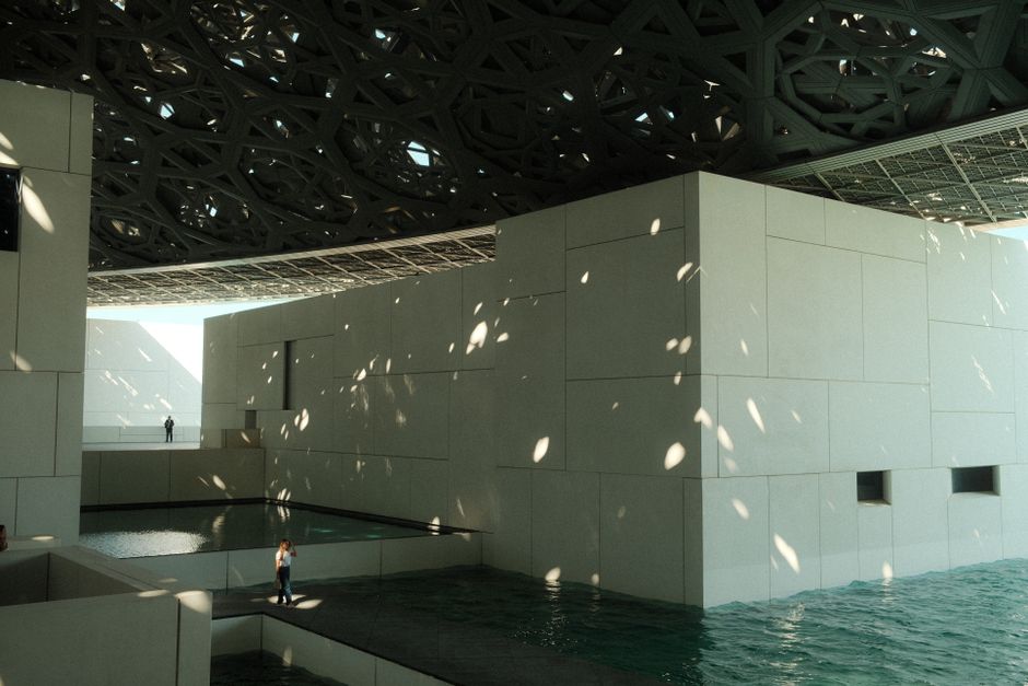Interior view of the Louvre Abu Dhabi, UAE, with natural light and art