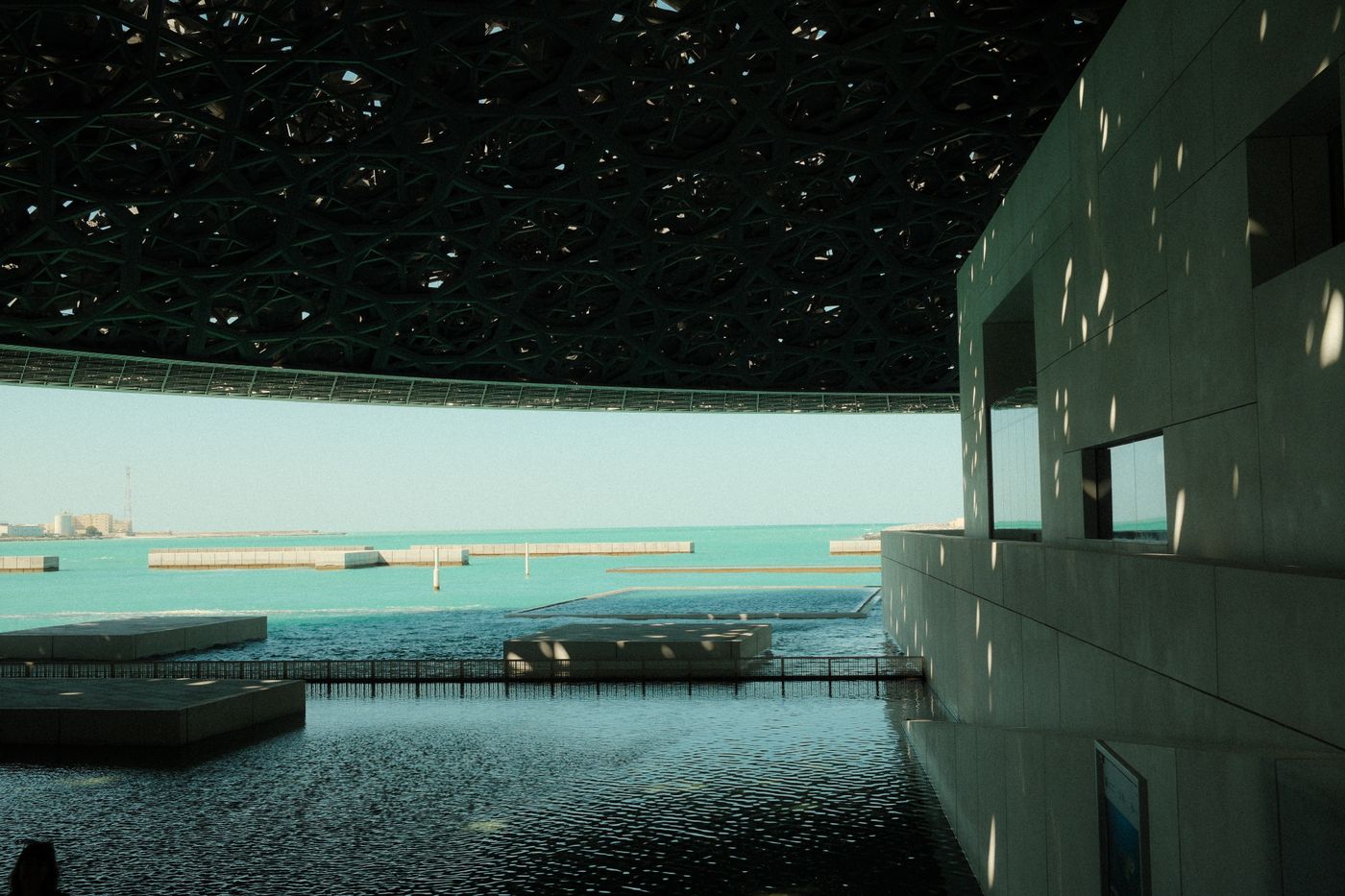 Louvre Abu Dhabi on Saadiyat Island beside calm sea