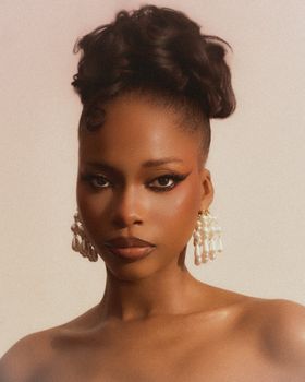 Stunning portrait of a woman with pearl earrings, captured in Lagos, Nigeria.