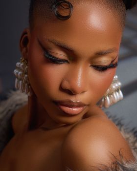 Close-up portrait of a young woman with elegant earrings, showcasing beauty and style.