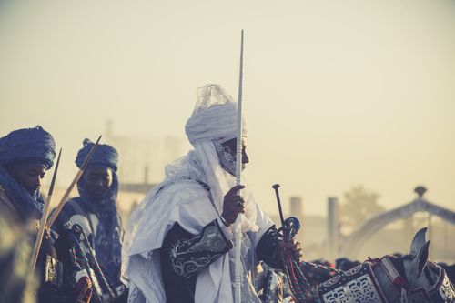 Free African horsemen in ornate traditional attire, showcasing cultural heritage and ceremonial traditions. Stock Photo