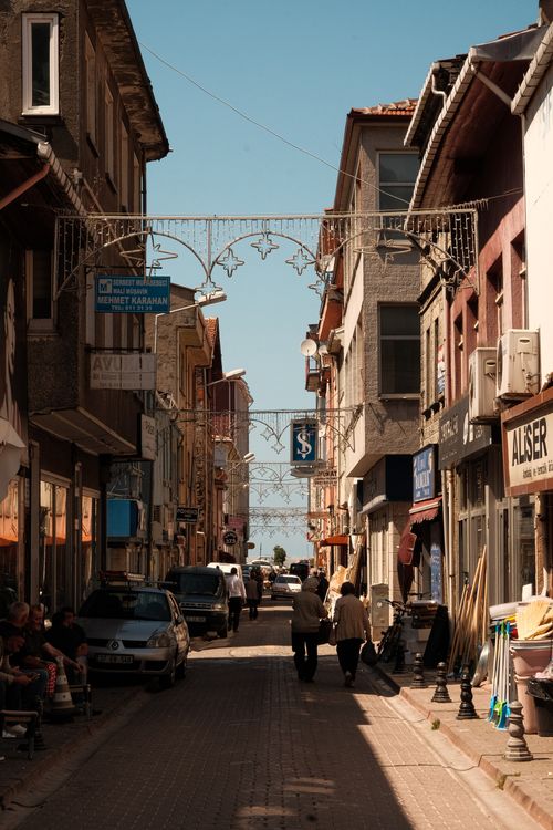 Free Explore the rustic charm of a bustling street in İnebolu, Kastamonu, Türkiye under a clear blue sky. Stock Photo