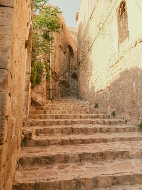 Free Explore the ancient stone stairs and architecture in the historic city of Mardin, Türkiye. Stock Photo
