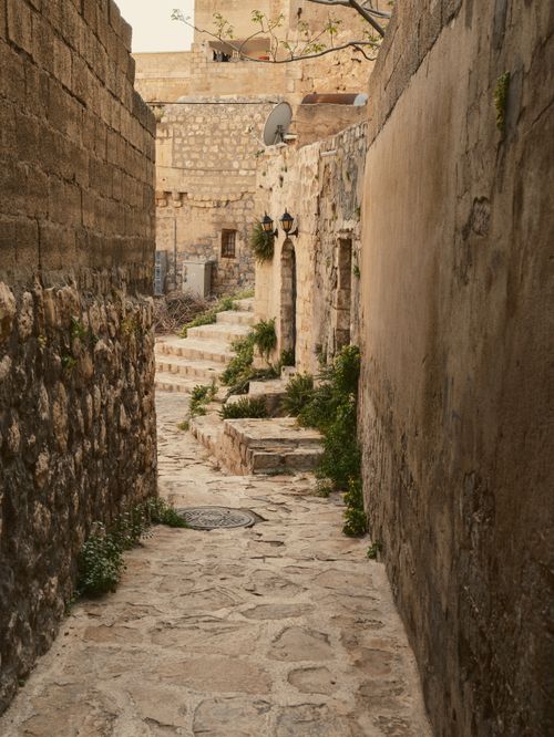 Free Explore the ancient stone pathways of Mardin's historic city center, exuding timeless charm. Stock Photo