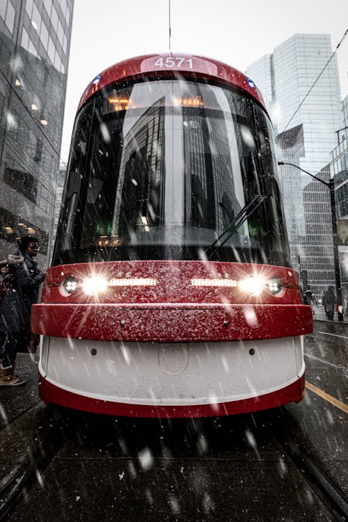 Red and White Train on the Street