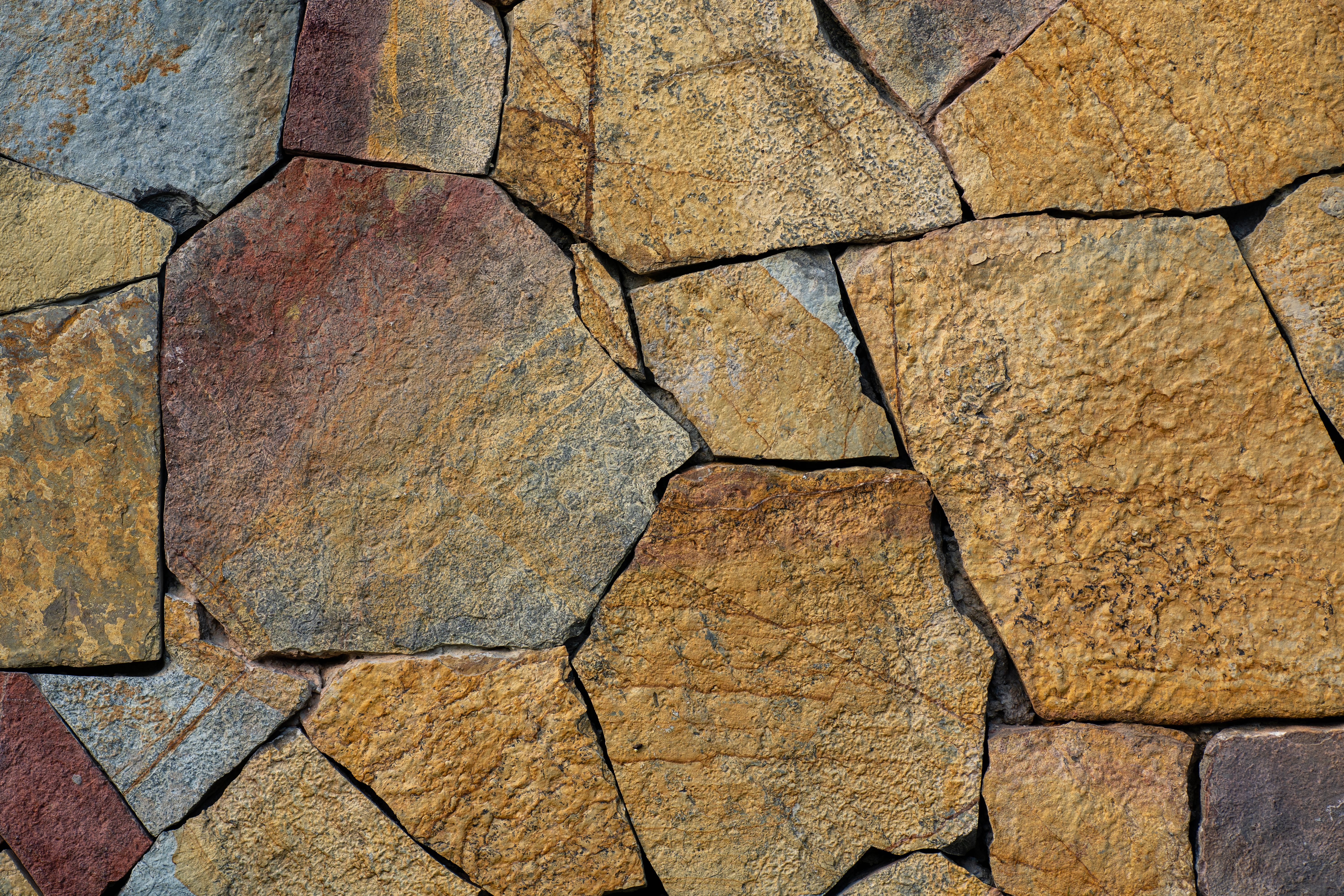 Granite, porphyry, basalt, sandstone, other monumental and building stone, whether or not roughly trimmed, cut, by sawing etc, into blocks or slabs of a rectangular (including square) shape