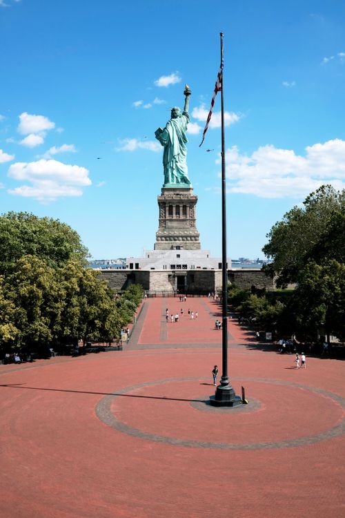 Free Iconic view of the Statue of Liberty with a bright blue sky in Jersey City, NJ. Stock Photo