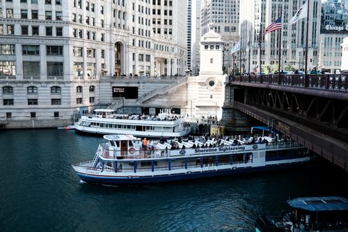 Free Tourist boats on the Chicago River offer scenic views of downtown architecture. Stock Photo